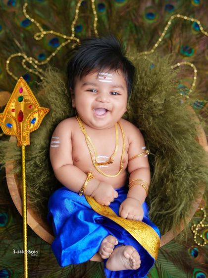 The most joyful little Lord Murugan you've ever seen! His wide, happy laugh makes this one of my favorite photos, full of divine energy and cuteness.
