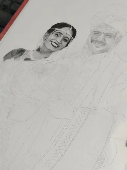 The wedding portrait is taking shape. The bride's face is fully detailed, and the rest of the drawing is a light sketch, waiting for the shading that will complete the piece.