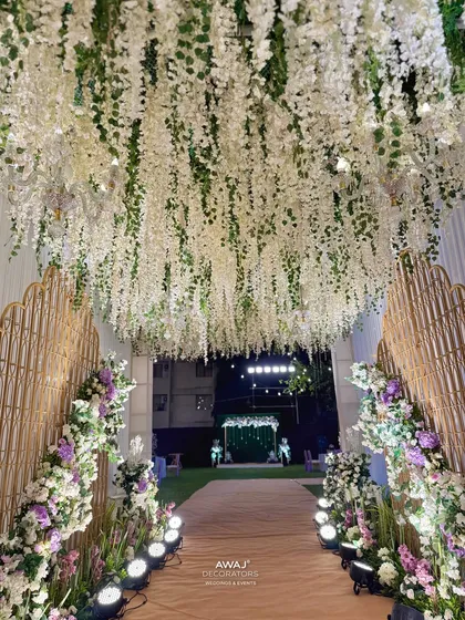 The view from the entrance, looking down the walkway towards a distant photo booth, creating a sense of journey.