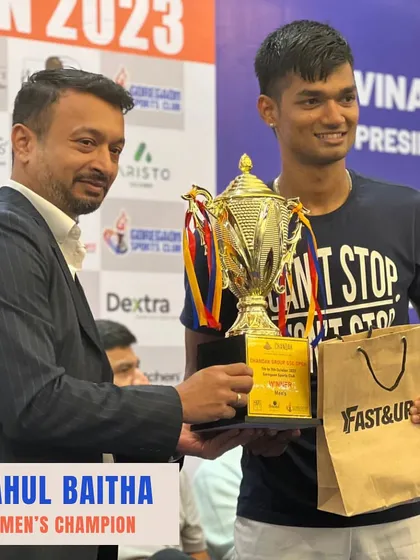 Presenting the Men's Champion trophy to Rahul Baitha. A professionally organized prize ceremony is the perfect end to a successful tournament.