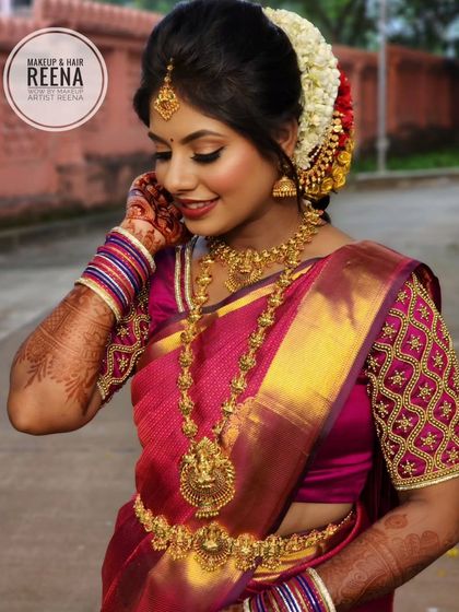 Remya looking absolutely radiant. Her embroidered pink blouse and traditional temple jewellery are the highlights of this beautiful South Indian bridal look.