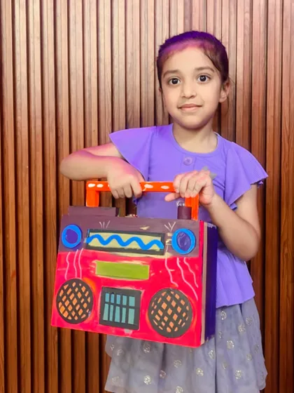 This student created a vibrant red boombox, complete with hand-drawn speakers and buttons.
