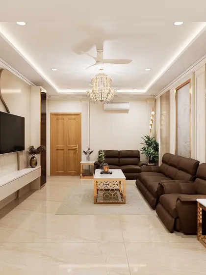 This living area design for a client in Hyderabad showcases a bright and luxurious space. Key features include custom latticework partitions, a floating TV unit, and a multi-layered false ceiling with integrated cove lighting to create a grand ambiance.
