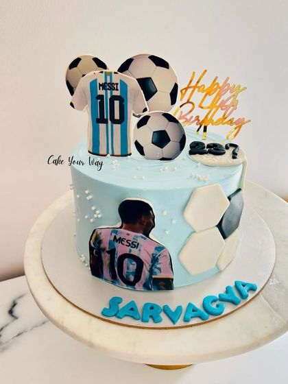 When the game gets tough, the cake gets sweeter. A Messi-themed football cake for a true fan.