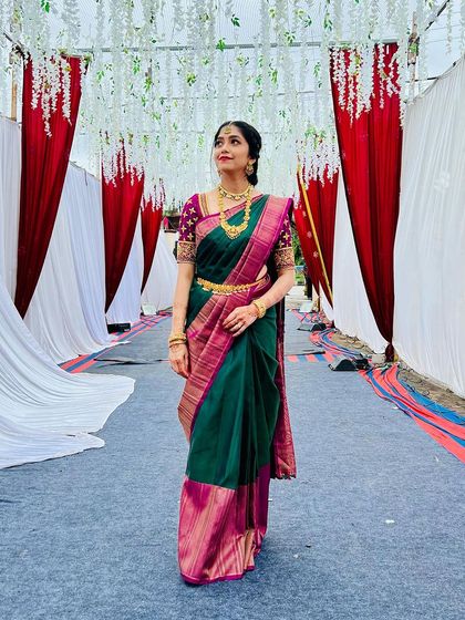 Posed in the wedding walkway, she looks absolutely regal. The makeup and hair are styled to perfection for this important family event.