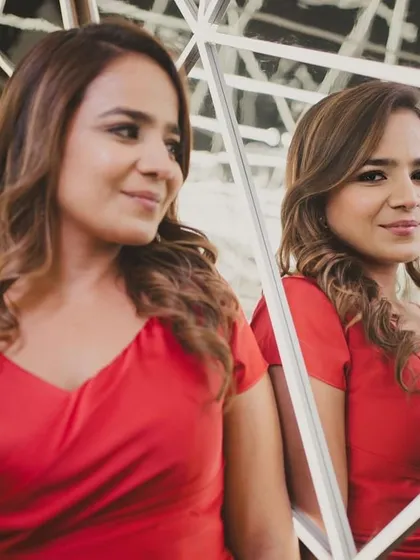 Anisha looking like a doll in this contemporary red dress, perfect for a celebratory evening. The makeup is soft and glowy, with a hint of drama in the eyes.