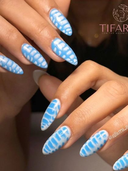 A final shot of the gorgeous blue and white abstract nails, showing their full length and almond shape.