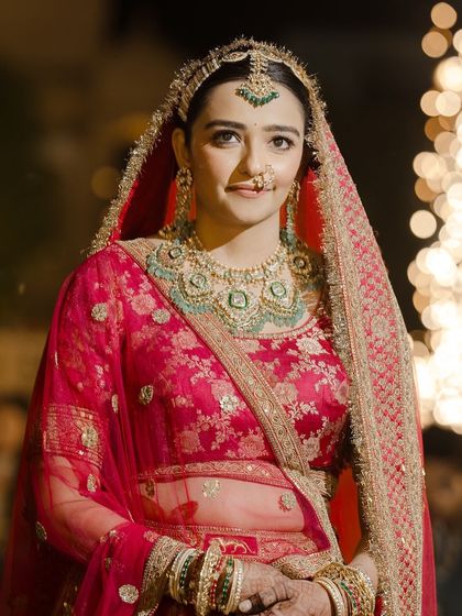 A stunning portrait of the bride, ready for her wedding. The makeup is regal, and her expression is full of anticipation.