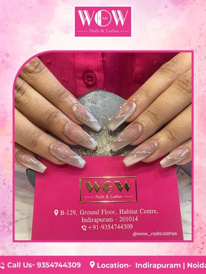 A modern twist on the French manicure, these coffin-shaped extensions feature a soft ombré base with sharp white V-tips and a delicate line of silver glitter for extra definition.