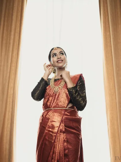 A creative shot from a professional photoshoot, where the makeup remains a key part of the elegant and classic story.