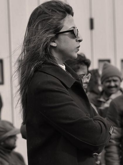 A candid, black and white photo of me in work mode on set. This captures my focus and concentration while overseeing the costume department during a shoot.