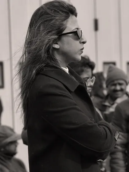 A candid, black and white photo of me in work mode on set. This captures my focus and concentration while overseeing the costume department during a shoot.