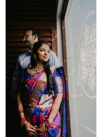 A beautifully composed shot of the couple. The makeup is subtle yet elegant, perfect for an intimate engagement ceremony.