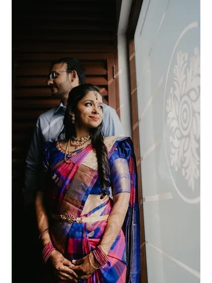 A romantic shot of the couple during their engagement. The bride's makeup is soft and natural, perfect for the occasion.