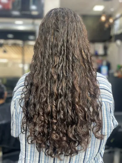 This client's naturally curly hair was treated with a deep hydration service to define the curls and eliminate frizz. The result is healthy, bouncy curls with beautiful definition.