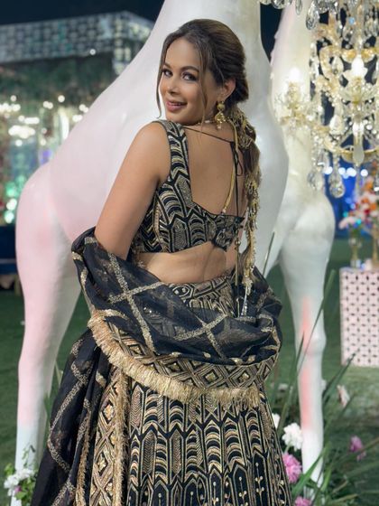 A look at the back of this gorgeous lehenga and the detailed hairstyle. Every element of my look is carefully planned to create a cohesive and stunning appearance.