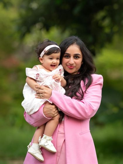 This little cutie is all smiles! I've been photographing this family for years, and it's a joy to watch them grow. Outdoor sessions like this are perfect for capturing genuine happiness.