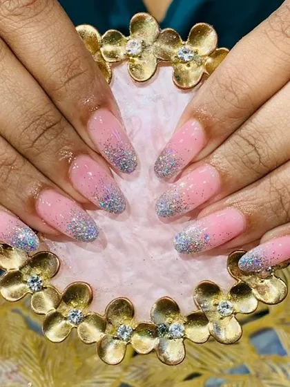 A beautiful pink base with a holographic silver glitter ombre on long, elegant almond-shaped extensions.