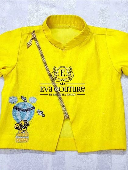 A close-up of the modern yellow kurta with the asymmetrical zip.