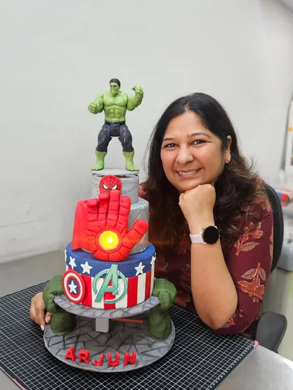 Me with the mighty Avengers anti-gravity cake. Creating these superhero cakes brings out the kid in me!