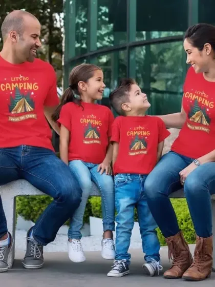 "Let's Go Camping" together. This family is all set for their outdoor adventure in bright red matching t-shirts, creating a picture perfect moment.