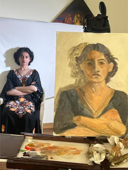 Another shot from the live session with Anamaya, showing my easel and palette setup. You can see the colors I mixed to capture her skin tones and the tones of her dress.