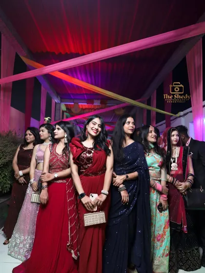 The bride's squad! A beautiful group photo of the bridesmaids and friends, all dressed up for the wedding festivities.
