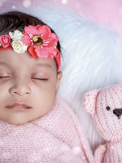 Another sweet close-up, with soft, dreamy lighting that highlights the baby's peaceful features.