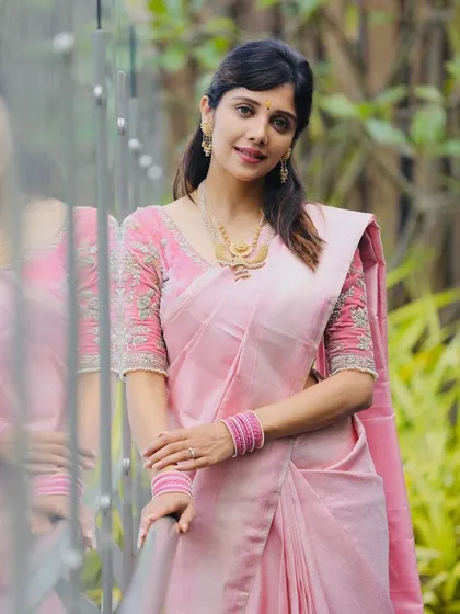 A full-length view of actress Milana Nagaraj in a soft pink saree and my custom-designed embroidered blouse. The outfit is perfect for an elegant daytime event.