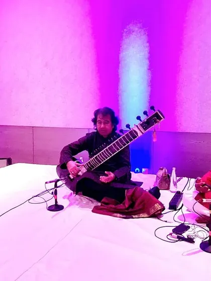 A trio performance with sitar and sarangi.
