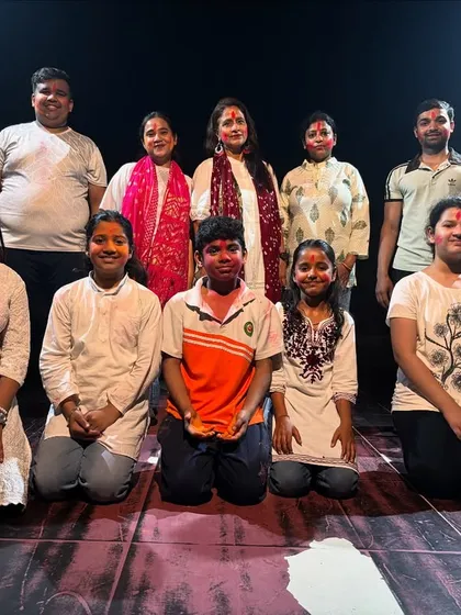 A group photo of our students after their energetic Holi performance, showcasing our community spirit.
