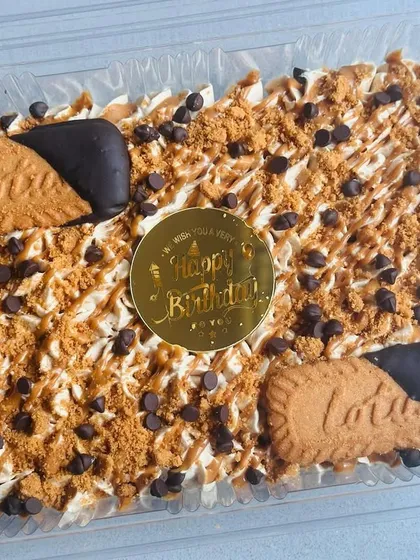 A decadent fusion of flavors, this is my Choco Biscoff Tres Leches. It combines a rich chocolate sponge with Biscoff-flavored milk, Biscoff mascarpone, and chocolate-dipped Biscoff biscuits.
