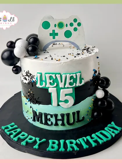 Level 15 unlocked for Mehul! This gaming cake features a controller, black and green details, and is perfect for a teenager's birthday.