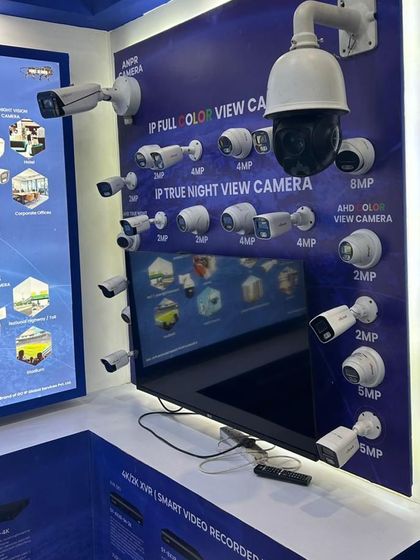 A look at our comprehensive display of surveillance cameras at an industry expo. We offer a wide range of IP cameras, including full-color view, true night view, and PTZ models with varying resolutions to suit any security need.