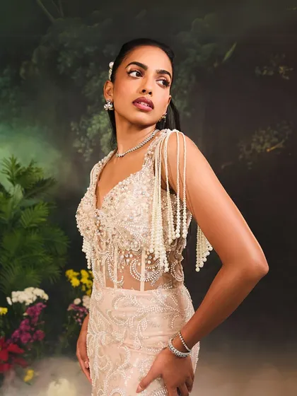 A closer view of the Nuray Gown's bodice, highlighting the intricate pearl work and the sheer corset that defines this captivating piece.