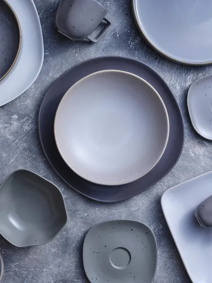 A close-up of the photograph on our wall, showing the different shapes and textures of our stoneware.