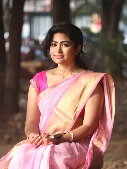 This look shows how I balance natural makeup with traditional attire. The skin is kept fresh and the lips have a natural tint, letting the beauty of the pink saree shine.