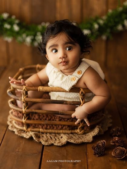 A curious expression replaces the giggle, showing the range of emotions we can capture in just a few moments during a sitter session.