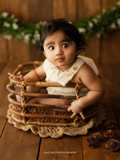 A curious expression replaces the giggle, showing the range of emotions we can capture in just a few moments during a sitter session.