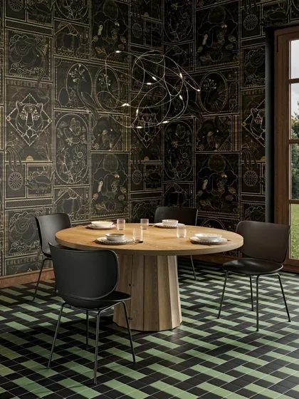 The Flock of Light in a dining setting, where its free-form, artistic shape adds a touch of whimsy and magic to the room.