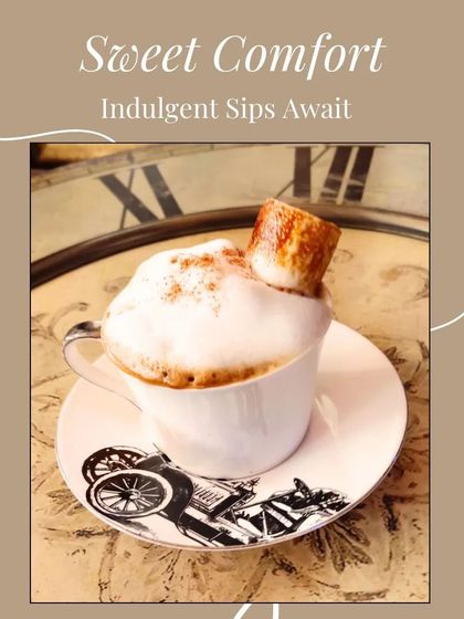 Sweet comfort awaits. A frothy cappuccino topped with a toasted marshmallow and served in a beautiful vintage cup is one of life's simple pleasures.