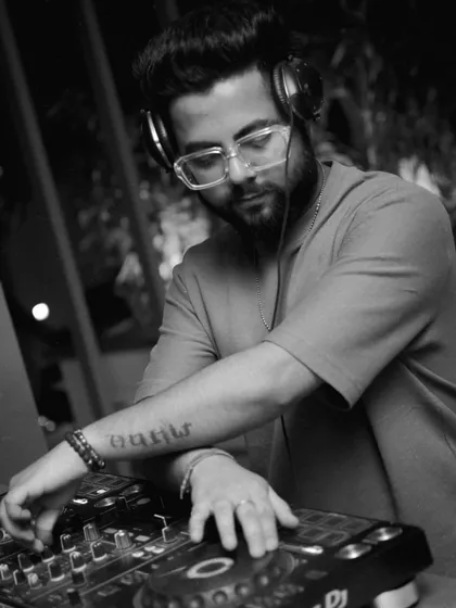 A black and white shot capturing my focus while mixing. It's all about the music and the craft.