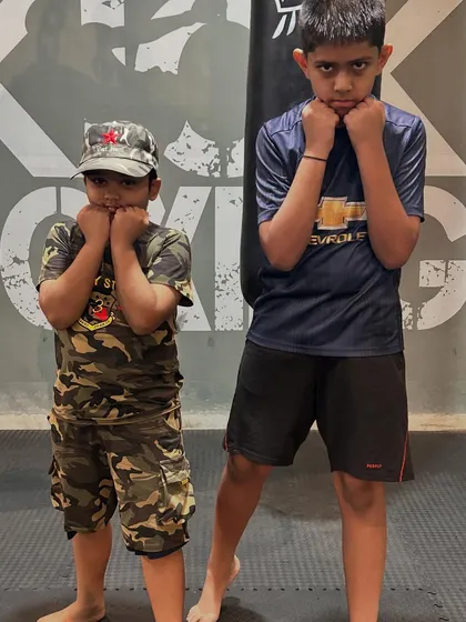 Two of our "little warriors" posing for a photo. They are learning valuable life skills while staying active and having fun.