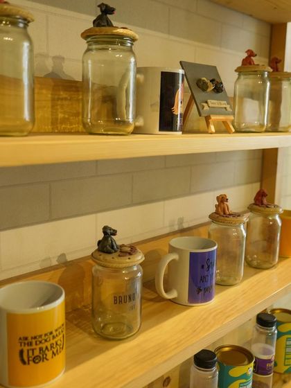 In addition to treats, I also offer custom merchandise like these treat jars and mugs, which can be included in any gift hamper.