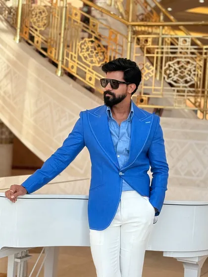 This angle highlights the sharp peak lapels and the smooth fit across the chest, demonstrating our attention to detail in every custom garment.