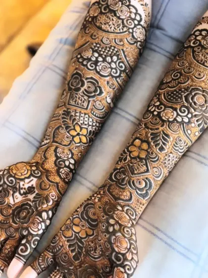A collection of my floral-heavy bridal designs. I love using roses and leafy vines to create a flowing, elegant look that covers the hands and arms.
