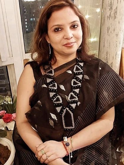 Our wonderful client, who inspired the geometric necklace, looking absolutely radiant. Seeing our custom pieces worn with such joy is the best reward.