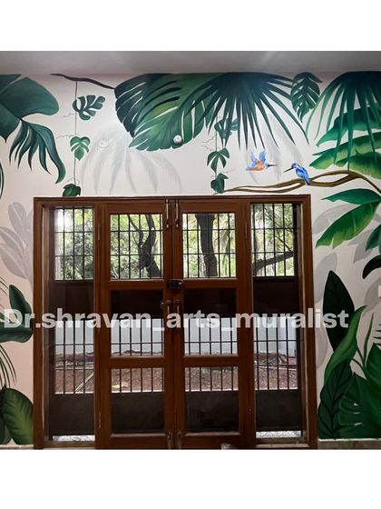 This tropical mural was designed to frame a set of French doors. The layered leaves and hanging vines create a sense of depth, making it feel like you are looking out into a lush garden.