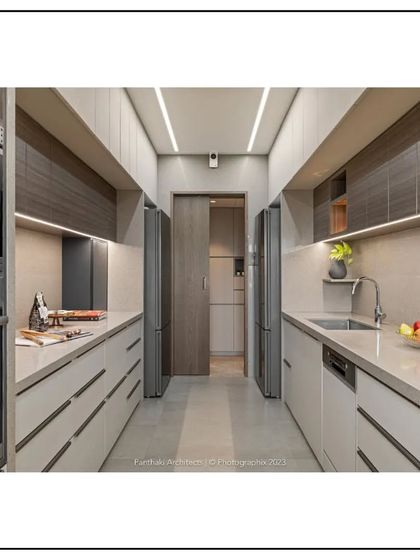 This modern galley kitchen is a study in functional elegance. We used a neutral color palette, handleless cabinets, and integrated appliances to create a clean, uncluttered look that maximizes efficiency in a compact space.