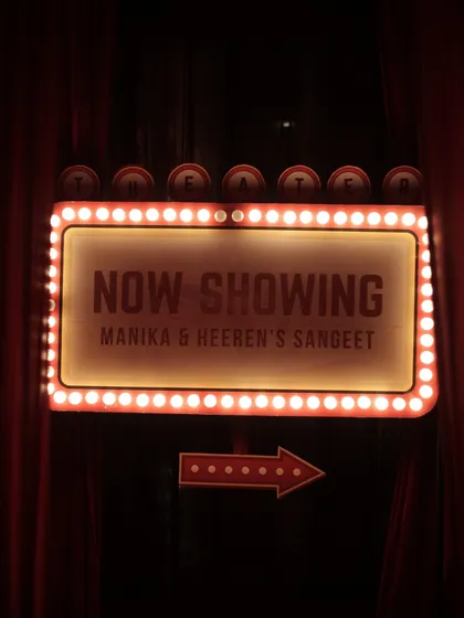 For a couple of movie lovers, we designed a Sangeet night with a cinematic premiere theme. This custom marquee sign, set against rich velvet drapes, welcomed guests to an evening of drama, dance, and old-Bollywood romance.